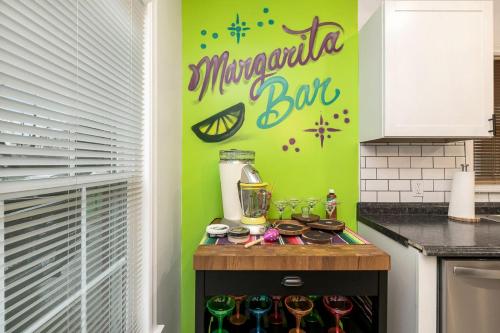 a kitchen with a counter with wine glasses and a blender at La Casa Bella 5BR 3BA Games 2 Living Areas in Louisville