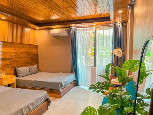 Ένα ή περισσότερα κρεβάτια σε δωμάτιο στο Villa Đường Mây