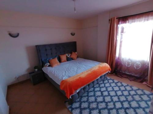 Ένα ή περισσότερα κρεβάτια σε δωμάτιο στο Maya's 2bedroom Tawan