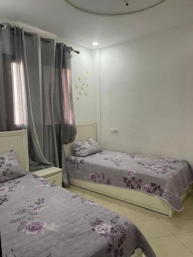 En eller flere senge i et værelse på Appartement