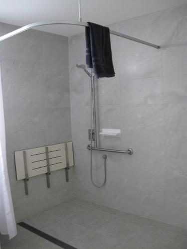 a shower stall in a bathroom with a shower curtain at Delegate Galley Cabin in Delegate