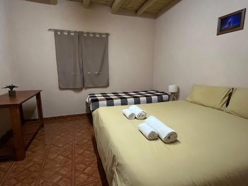 En eller flere senge i et værelse på El Amanecer