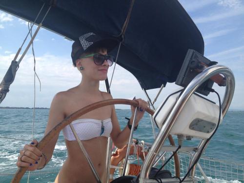 a woman in a bikini on a boat at Cavallino House Boat in Cavallino-Treporti