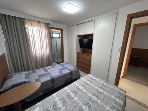 Giường trong phòng chung tại Village Acqua Guarajuba