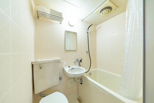 a bathroom with a toilet and a sink at Maison Junes 21 in Tokyo