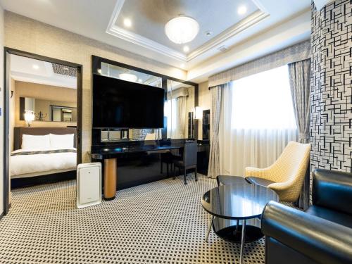 Postel nebo postele na pokoji v ubytování APA Hotel & Resort Midosuji Hommachi Ekimae Tower