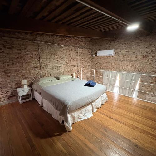Giường trong phòng chung tại Loft acuña