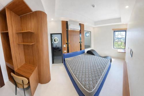 Postel nebo postele na pokoji v ubytování Habibi Hotel