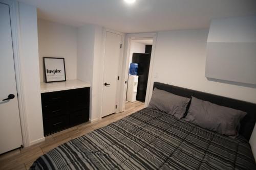 a bedroom with a bed and a refrigerator at Tiny Blue at Yosemite Gateway in Groveland