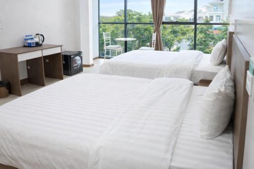 Ένα ή περισσότερα κρεβάτια σε δωμάτιο στο HN Hotel Bắc Ninh