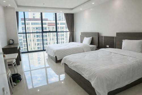 Ένα ή περισσότερα κρεβάτια σε δωμάτιο στο HN Hotel Bắc Ninh