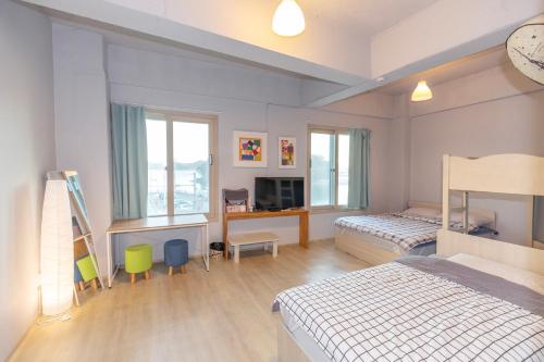 Ένα ή περισσότερα κρεβάτια σε δωμάτιο στο Wandonesia