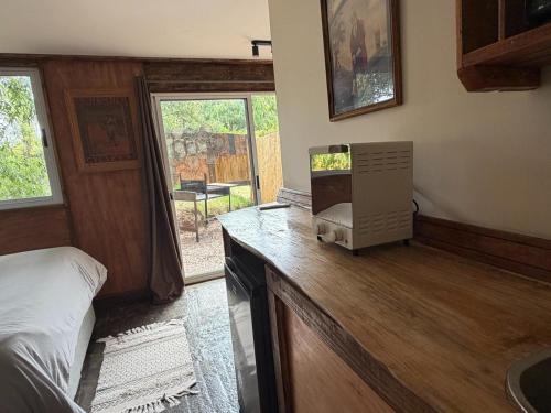 Køkken eller tekøkken på Cabañas en el Bosque a 5 minutos del mar - Estancia CH