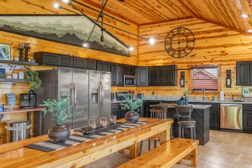 a kitchen with wooden walls and a wooden ceiling at Soaring Views Lodge in Sevierville