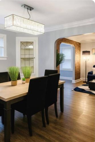 a dining room with a table and chairs at Spacious Three Bedroom Parma Home Sleeps six Near Cleveland in Parma
