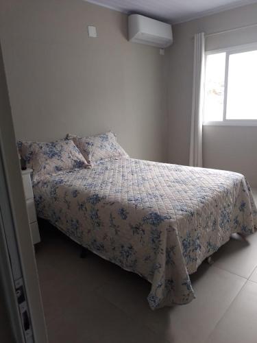 Postel nebo postele na pokoji v ubytování Lar Armação