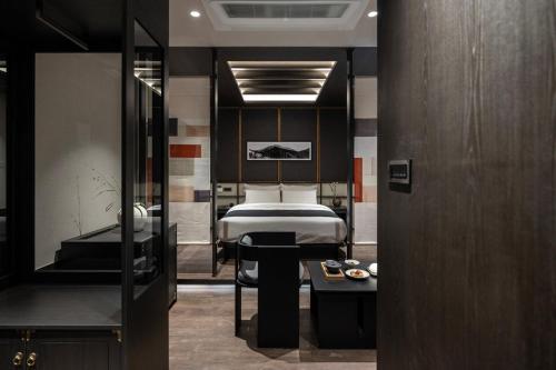 En eller flere senge i et værelse på Aank Hotel and Spa Jongno Unni