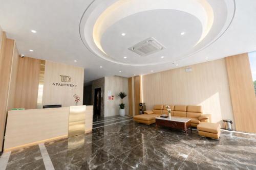 a lobby with a waiting room with couches and a table at TD Apartment in Hai Phong