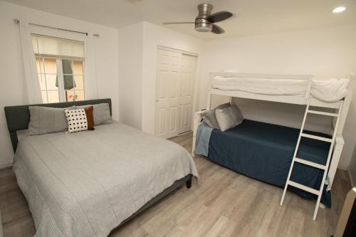 a bedroom with a bunk bed and a ladder at Yosemite Gateway home in Groveland in Groveland