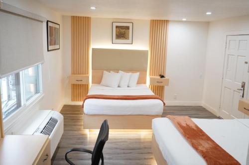 En eller flere senge i et værelse på San Francisco Inn