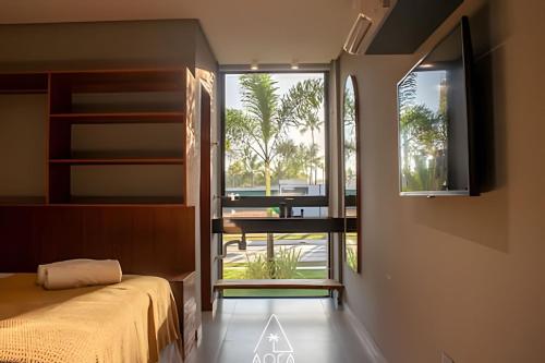 En eller flere senge i et værelse på Luxo na Praia do Marceneiro