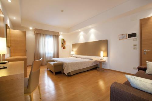 Giường trong phòng chung tại Hotel Campiello