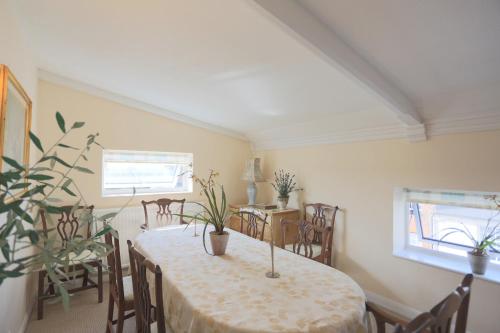 a dining room with a table and chairs at The Old Chapel in Arundel