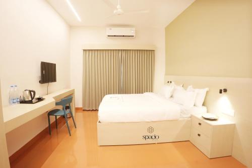 En eller flere senge i et værelse på Hotel Spacio