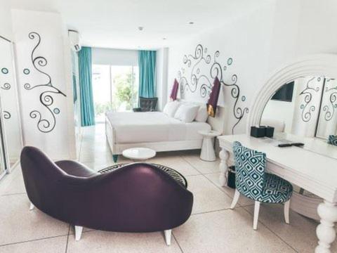 Postel nebo postele na pokoji v ubytování Dash Resort Langkawi