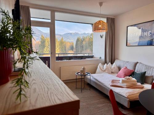 En eller flere senge i et værelse på Bergzeit Apartments