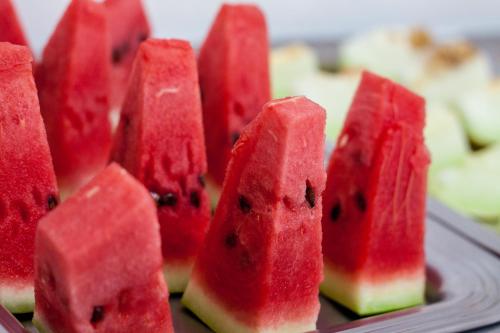 a group of red watermelon slices on a plate at Hotel Maraja in Uberlândia