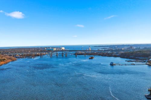 an aerial view of a river with a bridge at Riverside Retreat Waterfront Guest Suite in Groton