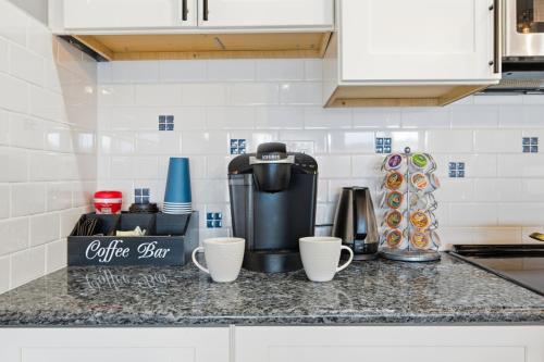 a coffee maker on a counter in a kitchen at Riverside Retreat Waterfront Guest Suite in Groton