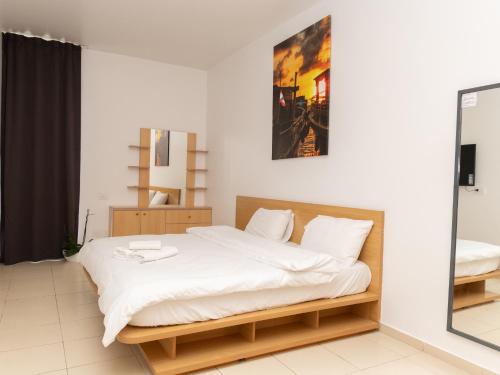 Llit o llits en una habitació de Siran Towers sal