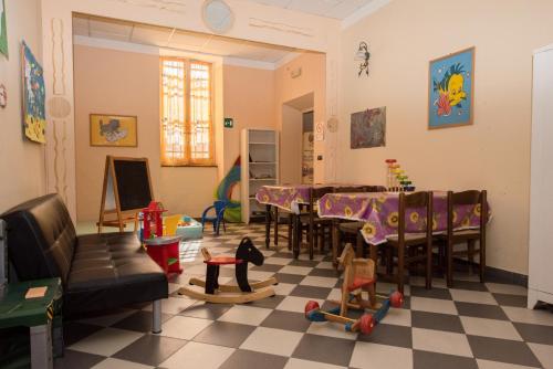 a living room with a table and chairs at Hotel Florenz in Finale Ligure