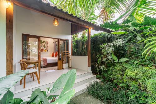 a bedroom in a villa with a garden at Bali Dream Garden - Tropical Escape with Pool & Spa in Ubud