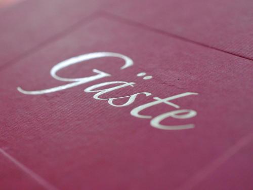 a close up of a red book with the word focus at Eisenberger Hof in Moritzburg