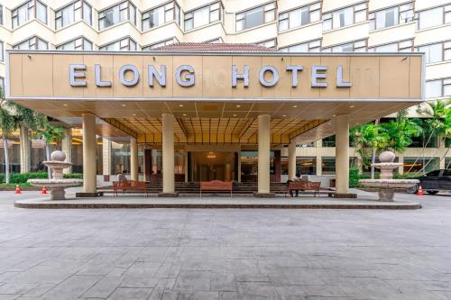 a large hotel with a sign that reads elong hotel at Elong Hotel Pattaya Jomtien Beach in Na Jomtien