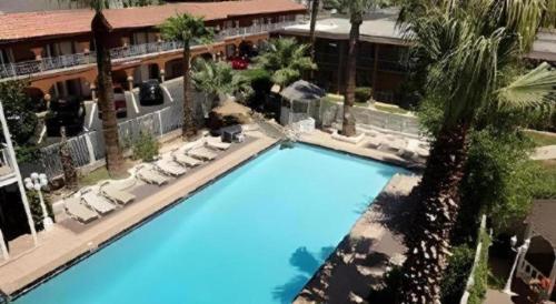 an overhead view of a swimming pool at a hotel at Shalimar Hostel in Las Vegas