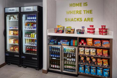 a grocery store with two refrigerators and drinks at Home2 Suites By Hilton Memphis Downtown in Memphis