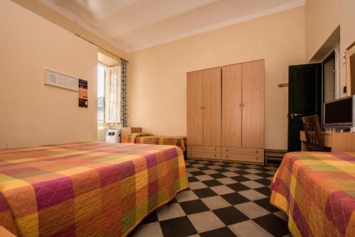Postel nebo postele na pokoji v ubytování Hotel Florenz