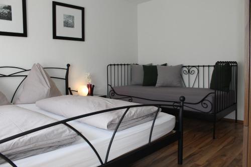 a living room with two beds and a couch at Apartment Seber in Stuhlfelden