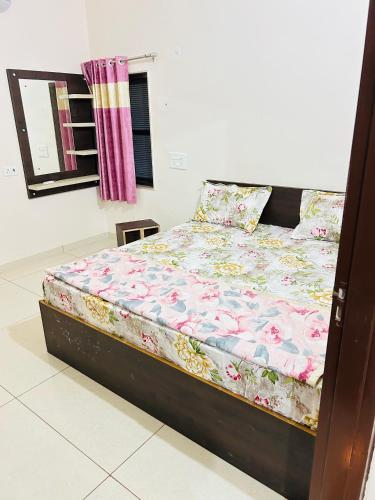 a large bed in a bedroom with at New hotel Arjun place, Reengus in Rīngas