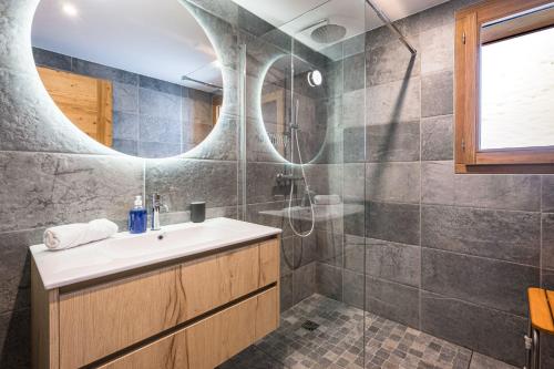 a bathroom with a sink and a shower at Chalet Angelus C201 in Saint-Jean-de-Sixt