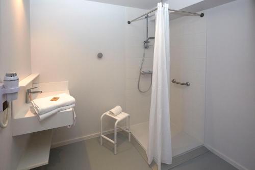 Koupelna v ubytování Coto Hotel