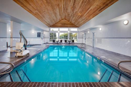 a swimming pool with a wooden ceiling at Homewood Suites by Hilton Sioux Falls in Sioux Falls
