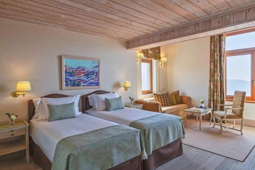 En eller flere senge i et værelse på Santa Marina Arachova Resort & Spa