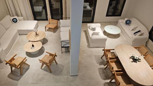 an overhead view of a living room with tables and chairs at EYZ Lofts By EYZ Holiday Homes in Batroûn
