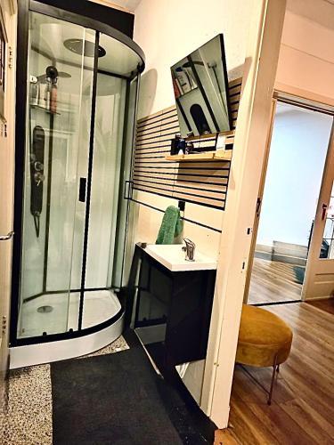 a bathroom with a shower and a sink at townhouse at the city in Enschede