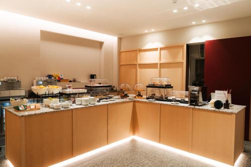 Kuchyň nebo kuchyňský kout v ubytování Hotel Astoria